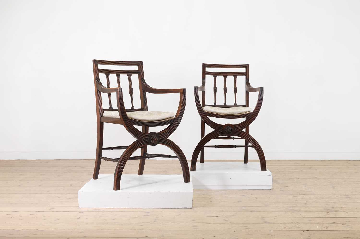 Lot 171 - A pair of mahogany armchairs in the Regency taste