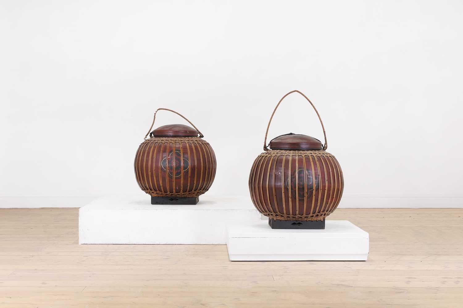Lot 307 - A pair of large red-lacquered rice carriers,