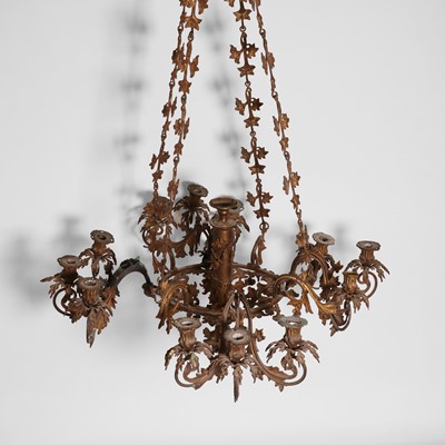 Lot 87 - A gilt-metal twelve-light chandelier