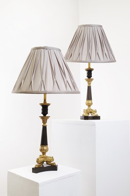 Lot 156 - A pair of Empire-style gilt and patinated bronze candlestick lamps