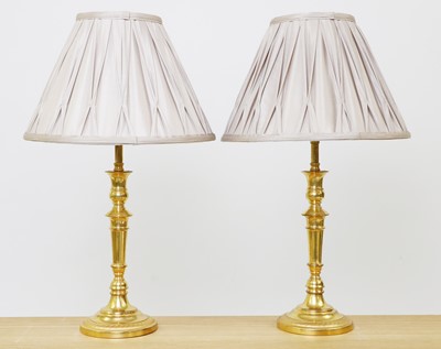 Lot 235 - A pair gilt bronze candlestick lamps