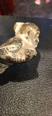 Lot 137 - Two carved stone turban hooks