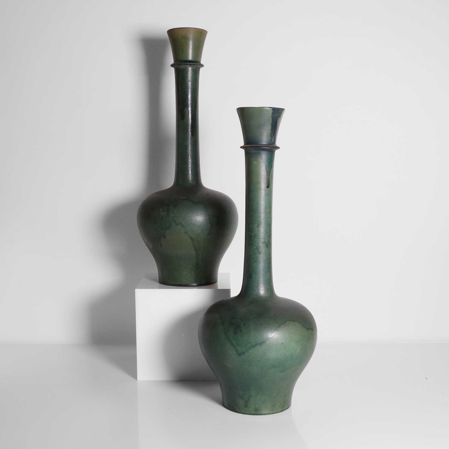 Lot 92 A pair of glazed earthenware vases,