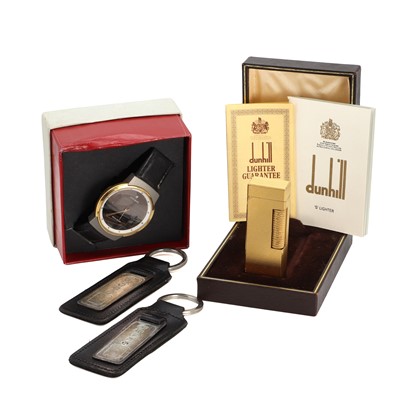 Lot 1455 - A Junghans wristwatch, a Dunhill lighter and two silver keyrings