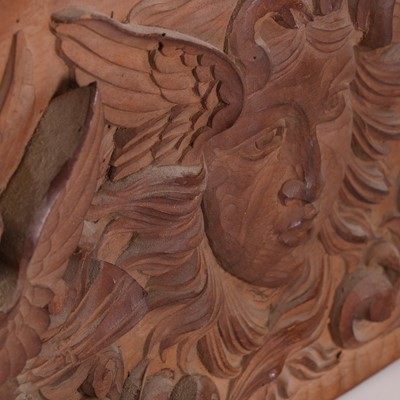 Lot 84 - A carved wooden panel