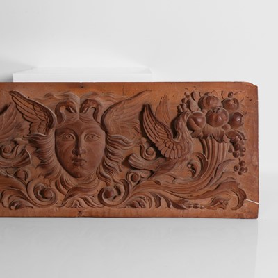 Lot 84 - A carved wooden panel