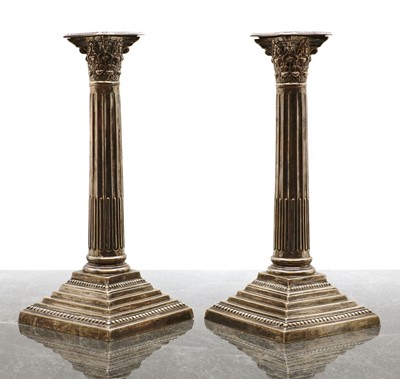 Lot 33 - A pair of Edwardian silver Composite column candlesticks