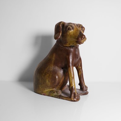 Lot 252 - A glazed earthenware model of a dog