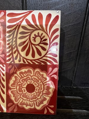 Lot 42 - A set of twelve 'Rose and Scroll' ruby lustre tiles