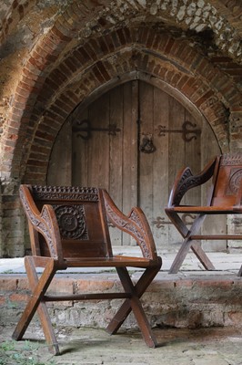 Lot 8 - A pair of carved oak Glastonbury chairs