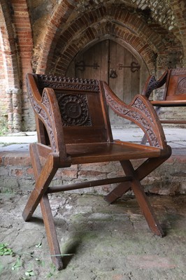 Lot 8 - A pair of carved oak Glastonbury chairs