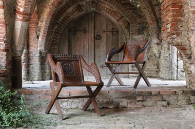 Lot 8 - A pair of carved oak Glastonbury chairs