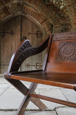 Lot 8 - A pair of carved oak Glastonbury chairs