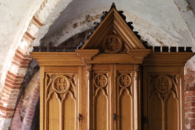 Lot 17 - A Victorian golden oak cupboard