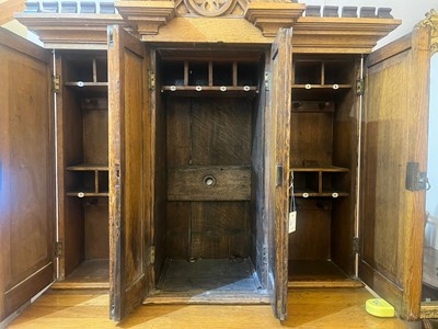 Lot 17 - A Victorian golden oak cupboard