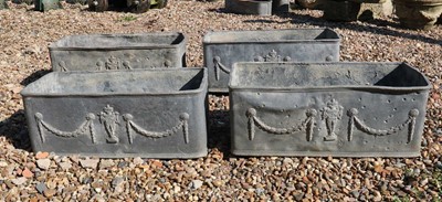 Lot 659 - A set of four lead trough planters