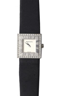 Lot 309 - An 18ct white gold diamond set Tiffany 'Atlas' quart strap watch