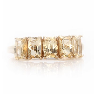 Lot 1140 - A 9ct gold five stone topaz ring