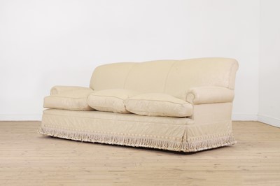 Lot 505 - A three-seater cream settee