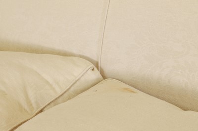 Lot 505 - A three-seater cream settee