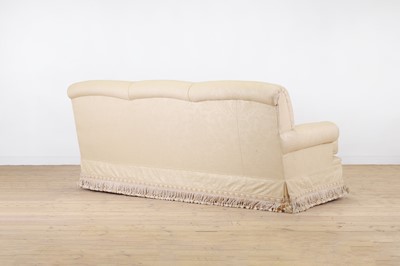 Lot 505 - A three-seater cream settee