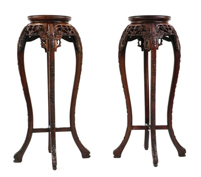 Lot 646 - A pair of hardwood jardiniere stands