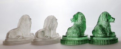 Lot 112 - Two pairs of John Derbyshire pressed glass lions