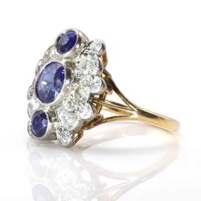 Lot 46 - A sapphire and diamond vertical three stone cluster ring
