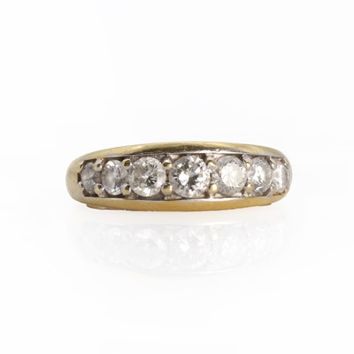 Lot 1064 - An 18ct gold half eternity ring