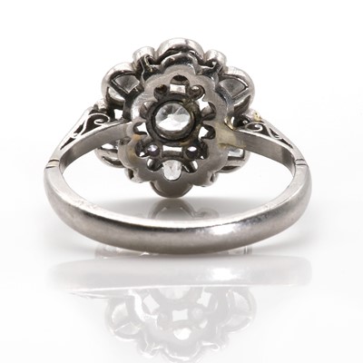 Lot 43 - A platinum and diamond flowerhead cluster ring