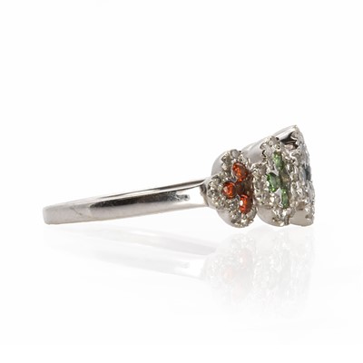 Lot 1090 - A 9ct white gold coloured diamond cluster ring