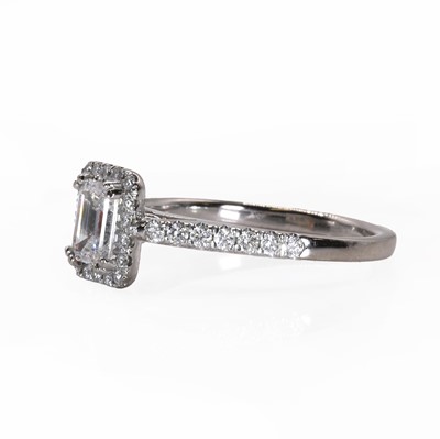 Lot 102 - An 18ct white gold emerald cut diamond rectangular cluster ring