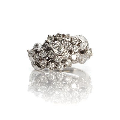Lot 1061 - A white gold diamond cluster ring