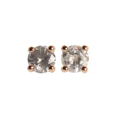 Lot 1069 - A pair of rose gold diamond studs