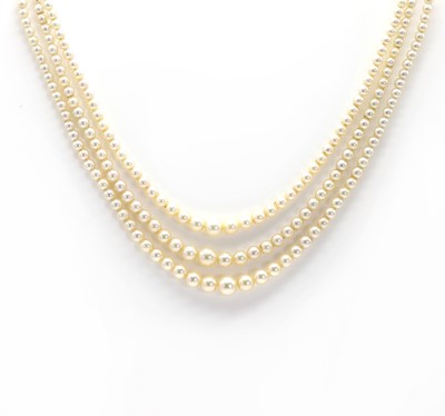 Lot 200 - A cased three row graduated pearl necklace with an old European diamond set clasp