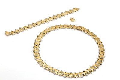 Lot 131 - An 18ct gold diamond set necklace and bracelet set, by Mappin & Webb