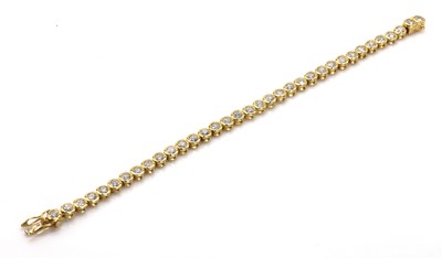 Lot 242 - An 18ct gold diamond line bracelet