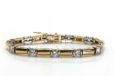 Lot 241 - A two colour gold diamond set bracelet