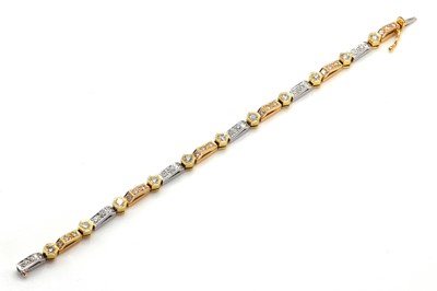 Lot 247 - An 18ct three colour gold and diamond line bracelet