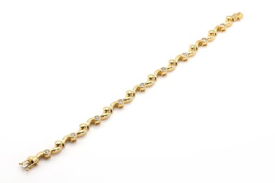 Lot 248 - An 18ct gold diamond set scrolling design bracelet