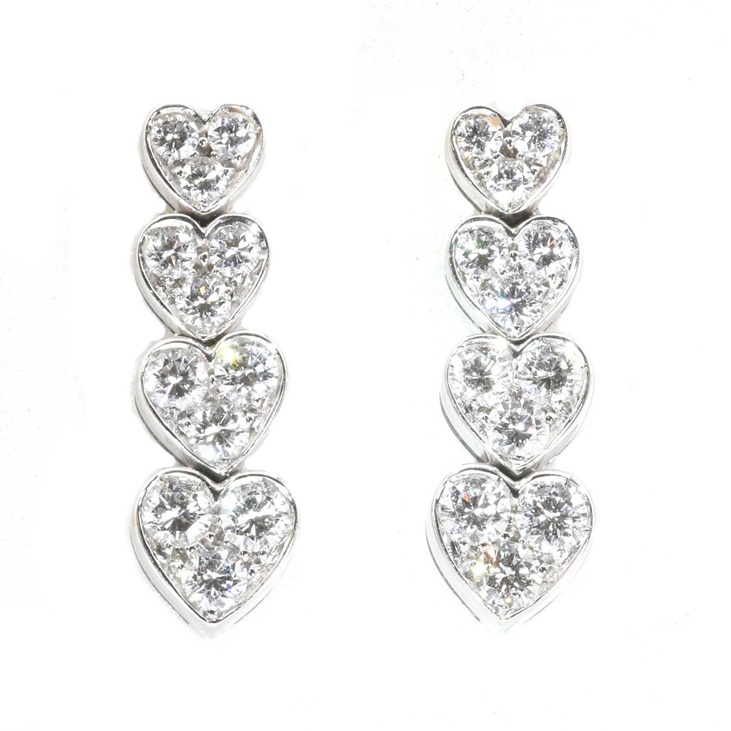 Lot 171 - A pair of white gold articulated heart diamond drop earrings