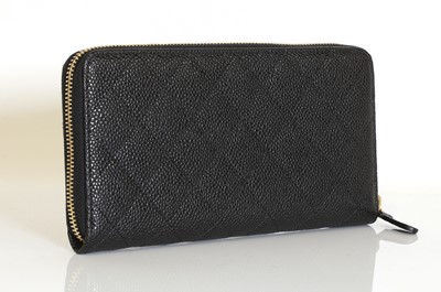Lot 343 - A Chanel black grained calfskin zip around wallet