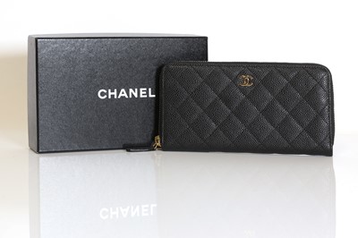 Lot 343 - A Chanel black grained calfskin zip around wallet