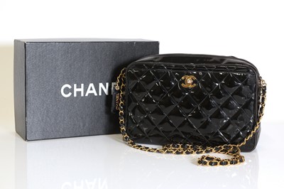 Lot 321 - A Chanel black patent leather camera bag