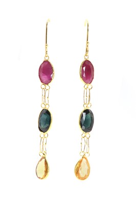 Lot 255 - A pair of gold ruby and sapphire three stone pendant earrings