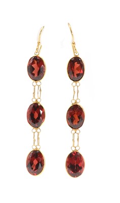 Lot 1116 - A pair of gold garnet drop earrings