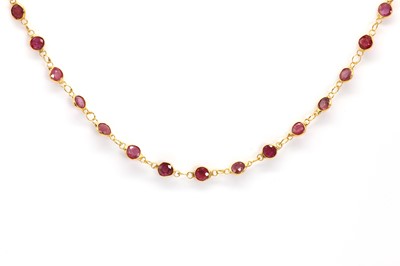 Lot 83 - A gold spectacle set ruby necklace