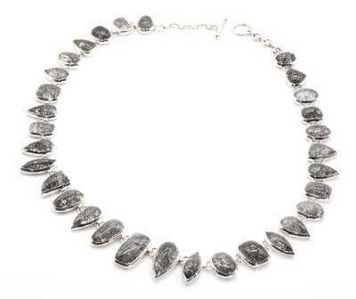 Lot 1185 - A silver tourmalinated quartz necklace