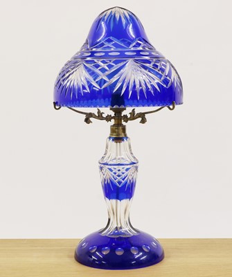 Lot 271 - A Bohemian blue flashed cut glass table lamp