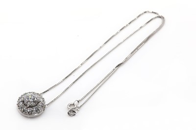 Lot 96 - A  white gold diamond set circular cluster pendant and chain